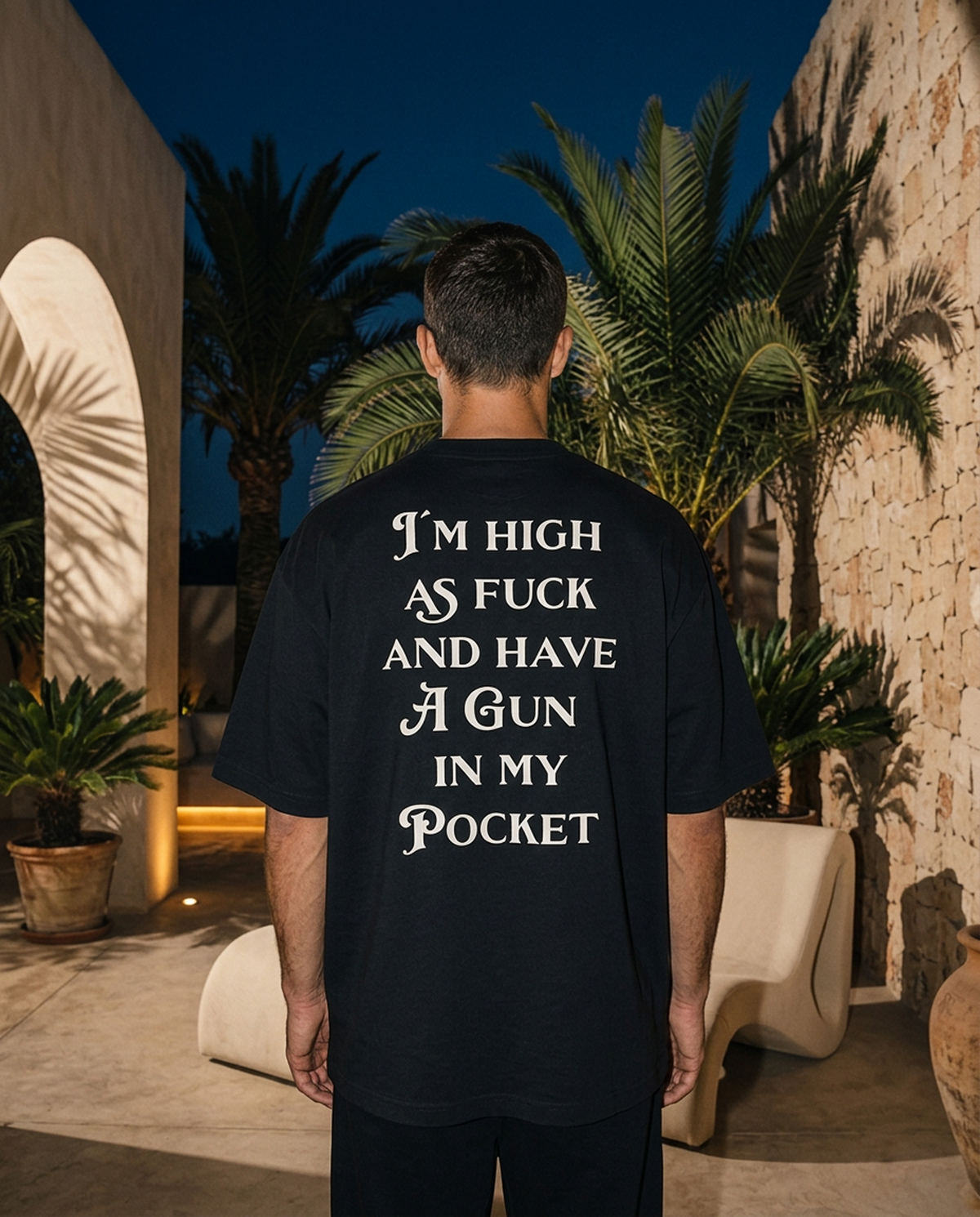 Gun In My Pocket oversized tee in Black — editorial