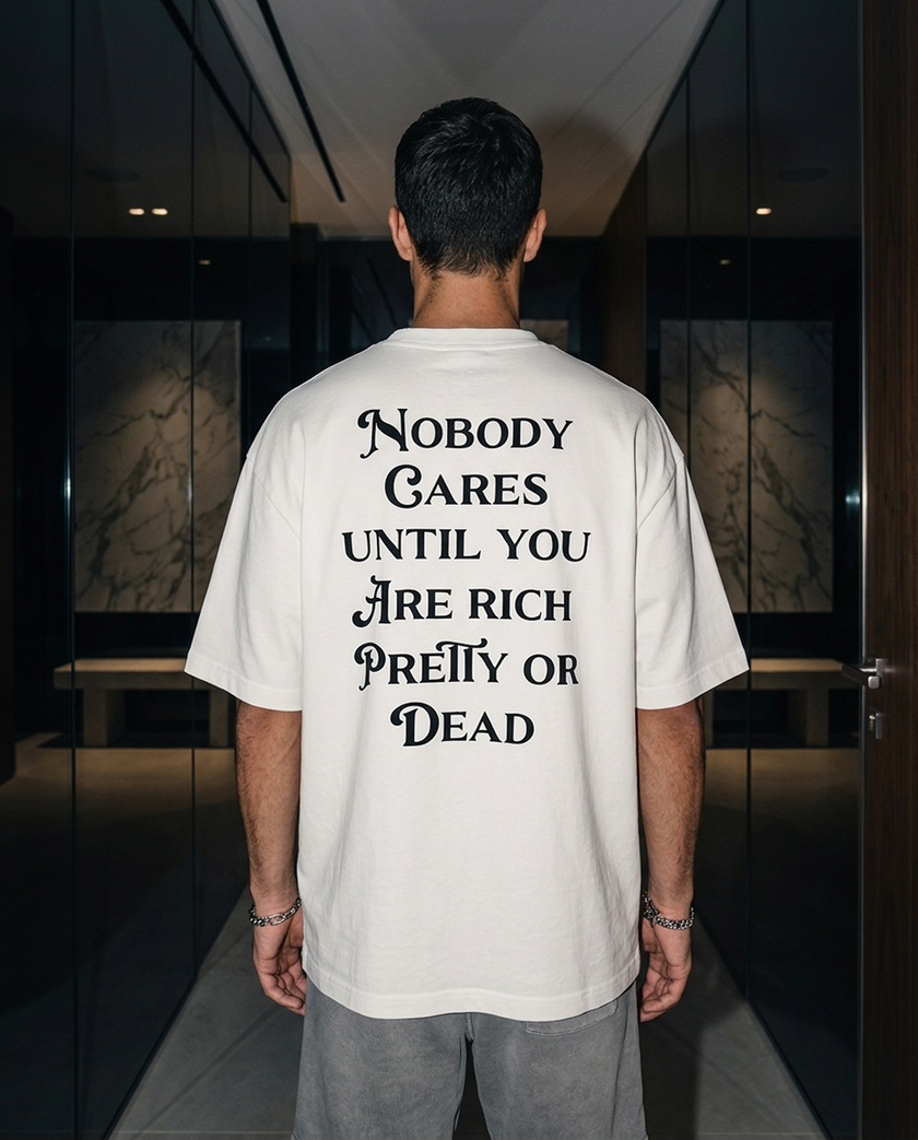 Nobody Cares Until oversized tee in White — lifestyle worn by model